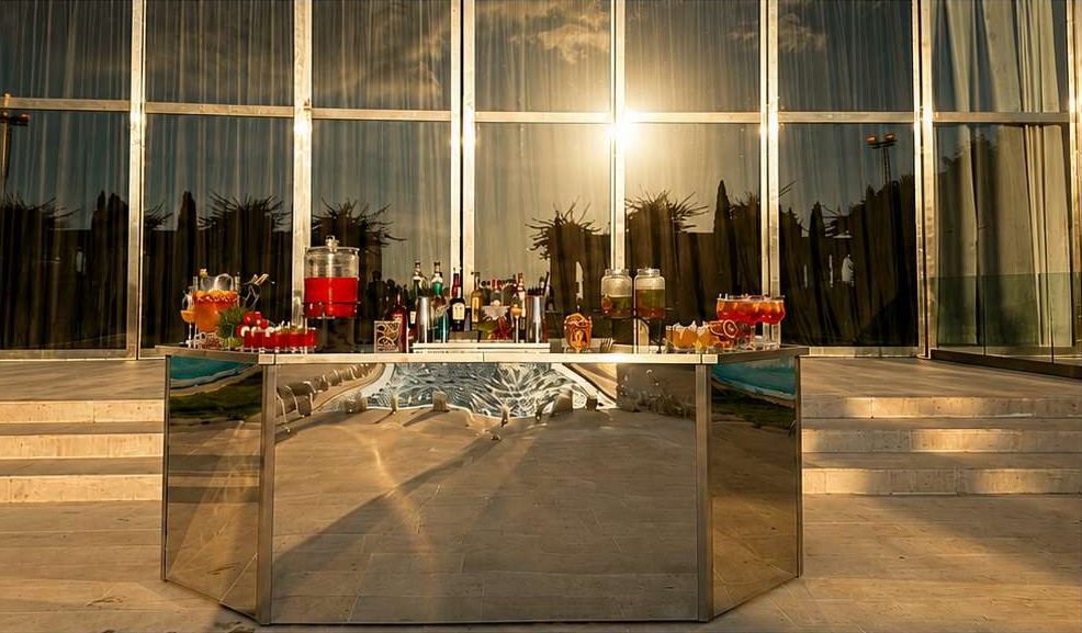 Mirror bar prepared with glassware and cocktails